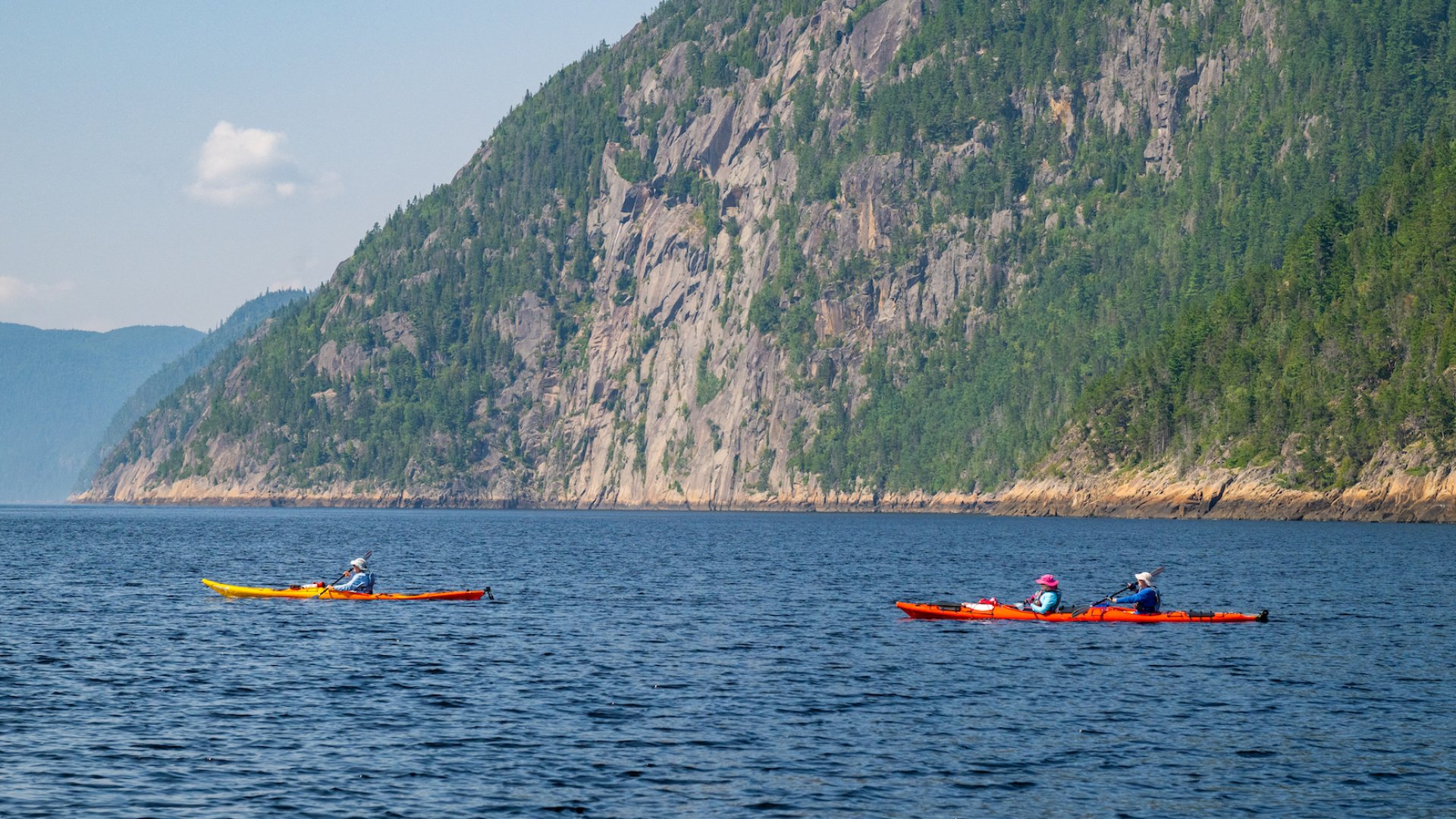 Two tandem sea kayaks in a fjord near Quebec