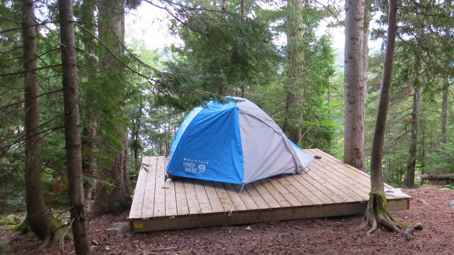 tent on platform in quebec wilderness area